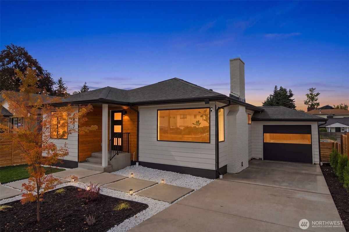 Original listing photograph of 4807 15th Avenue S at twilight, with its NWMLS watermark preserved