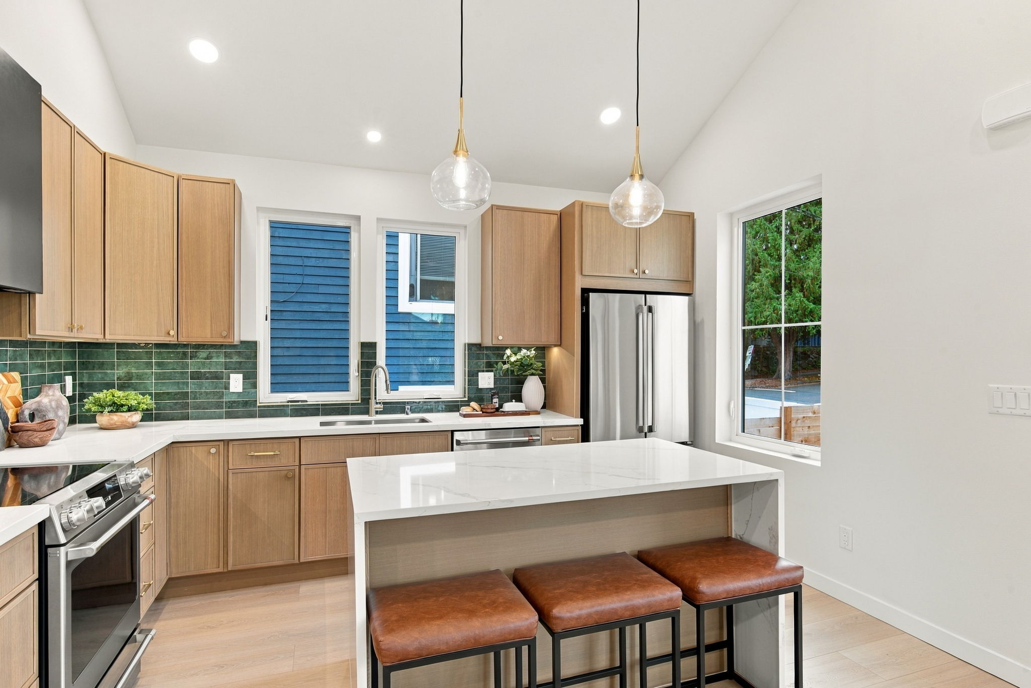 Wood cabinetry and quartz island in the 5606 kitchen